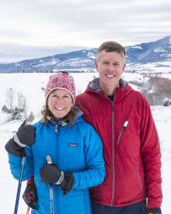 McCormick Financial founder and principal advisor Mike McCormick outside in the snow with his wife in Bozeman, MT